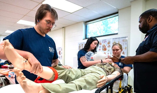 Benjamin Shumway applies a tourniquet on a manikin during BC3’s inaugural EMS Academy.