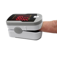 MedTech fingertip pulse oximeter clipped on a finger reading blood oxygen